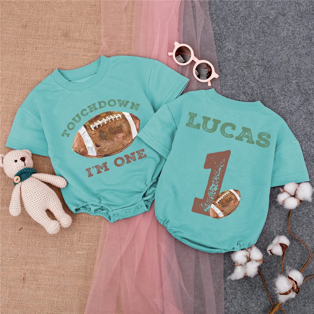 Birthday keepsakes arranged beside a personalized outfit